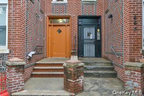 Brick exterior featuring contrasting entry doors
