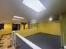 Below grade area with a paneled ceiling and a heating unit