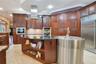 Custom Kitchen: Prep Sink, Snackbar, Custom Cabinets with under and over lighting, Hybrid Induction Cooktop, Hidden walk-in pantry