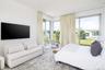 Carpeted bedroom with access to exterior