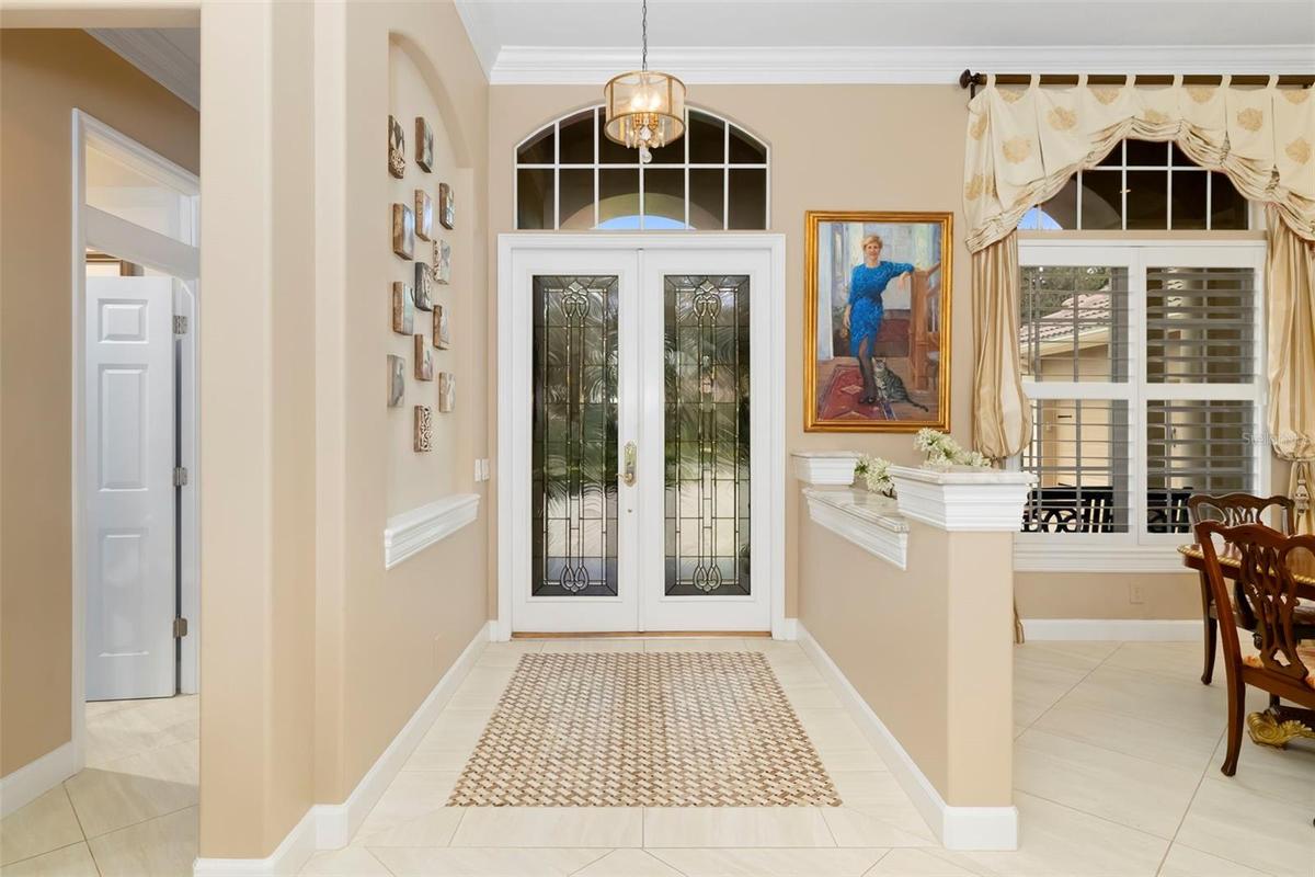 Foyer with herringbone tile inlaid