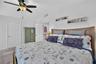 Spacious primary suite with ample room and natural light.