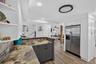 Kitchen view highlighting modern finishes and generous counter space.