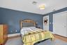 Bedroom with a closet and wood finished floors