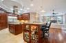 Custom Kitchen: Prep Sink, Snackbar, Custom Cabinets with under and over lighting, Hybrid Induction Cooktop, Hidden walk-in pantry