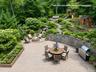 Virtually reimagined yard with firepit, play area and chicken coop