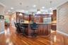 Custom Kitchen: Prep Sink, Snackbar, Custom Cabinets with under and over lighting, Hybrid Induction Cooktop, Hidden walk-in pantry