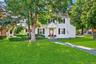 Colonial inspired home with a front yard