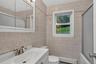 Conveniently located main-level full bathroom serves the three bedrooms and main living area.