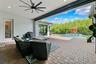 Covered patio offers protection from the Florida sun when needed and includes a hurricane rolldown shutter.