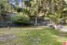 flat yard adjacent to unpaved