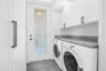 Washer and Dryer tucked away off kitchen