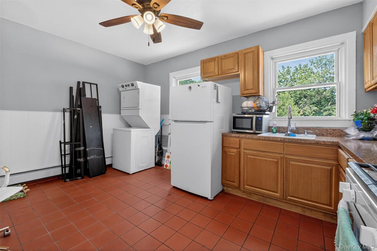 Eat-in kitchen complete with in unit washer and dryer.