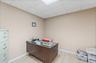 Office area with a paneled ceiling