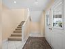 Stairs to main living level...there is a shaft to accommodate an elevator!