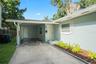 Carports provide covered parking along with driveway parking.