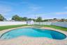 Backyard Oasis with Pool/Storage Shed and Fenced-In Backyard