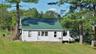 View of front of property with a front lawn