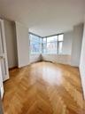 Unfurnished room featuring crown molding and a city view