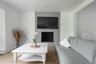 Living area featuring a tile fireplace, wood finished floors, and recessed lighting