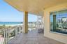 Covered waterfront balcony ideal for relaxing and there is enough room for a dining al fresco experience!