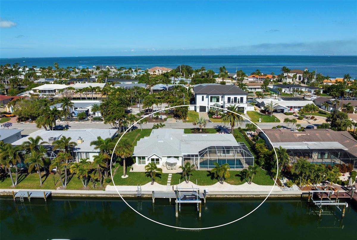 Situated on an 11,543 square foot lot with 100 feet of waterfrontage