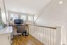Office space with hardwood / wood-style floors