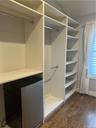 Transformed 3rd Bedroom has built in closet, featuring hardwood floors and refrigerator. Perhaps the finished 4th floor could be used as another bedro