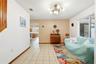 This room is staged as a dining room in photo 25