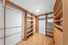 Spacious closet with light wood-style floors