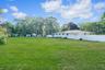 View of yard featuring view of wooded area