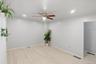 Spare room featuring ceiling fan and light wood-style floors