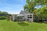 Back Yard with seating, grill, and outdoor shower