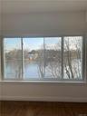 Master Bedroom Ensuite with huge picture window with view of Mill Pond and the Long Island Sound! 2 large closets (1 walk-in) and beautiful hardwood f