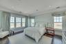 Bedroom with crown molding, dark wood-style floors, and recessed lighting