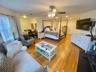 Bedroom featuring light hardwood / wood-style floors and ceiling fan