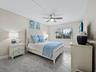The 2nd bedroom has an ensuite bath, a separate water closet, and a large walk-in closet that features a washer and dryer