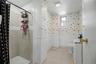 Tiled shower stall with a single handle fixture