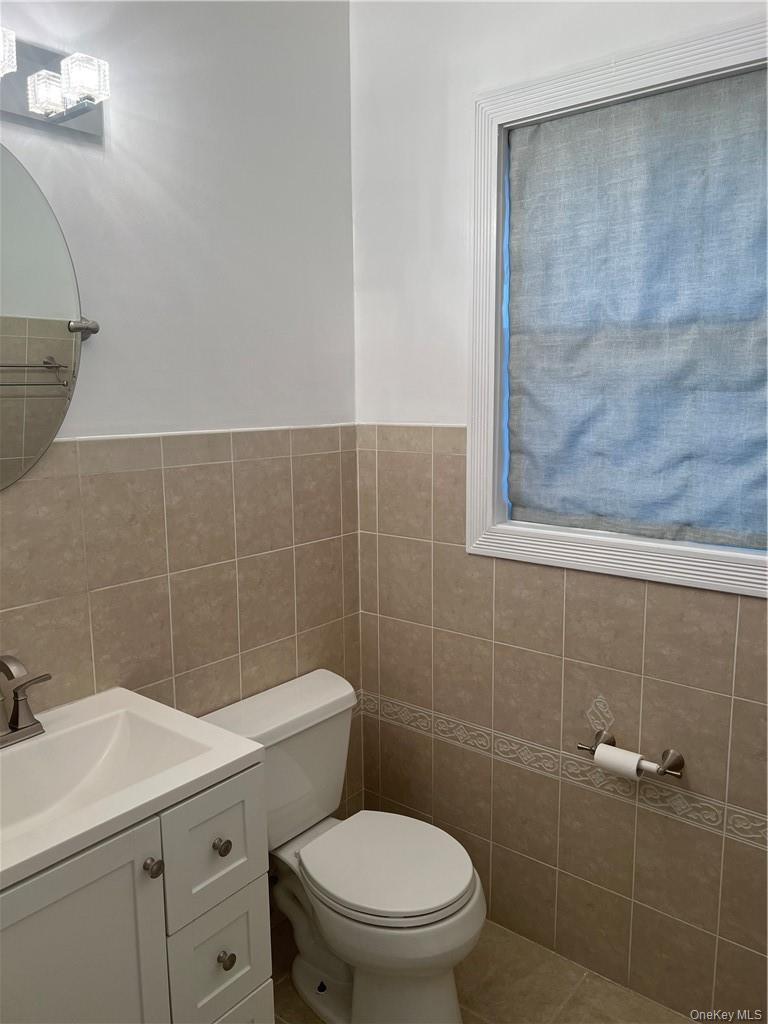 This is a half bath/powder room. It's right on the main level. So, it's convenient for your guests!