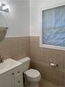 This is a half bath/powder room. It's right on the main level. So, it's convenient for your guests!