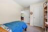 Neutral-toned room featuring light beige walls and light brown carpet flooring