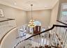 Masterfully Designed Two Story Grand Staircase