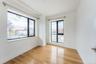 Spare room with light wood-type flooring and baseboards