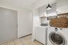 View of garage door entrance with laundry area