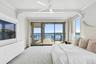 Bedroom featuring access to exterior, a water view, recessed lighting, and ceiling fan