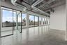 Spare room featuring finished concrete flooring and a skyline view