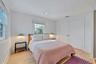 Bedroom featuring light wood finished floors, a closet, and recessed lighting