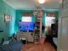 Bedroom featuring wood finished floors and ornamental molding