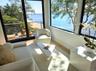 Sitting room with wood finished floors and a water view