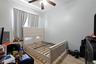 Room featuring light-toned walls and wood-finish flooring